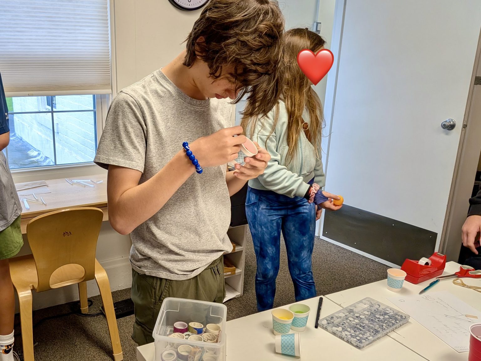 Upper unit students collaborating on a science experiment