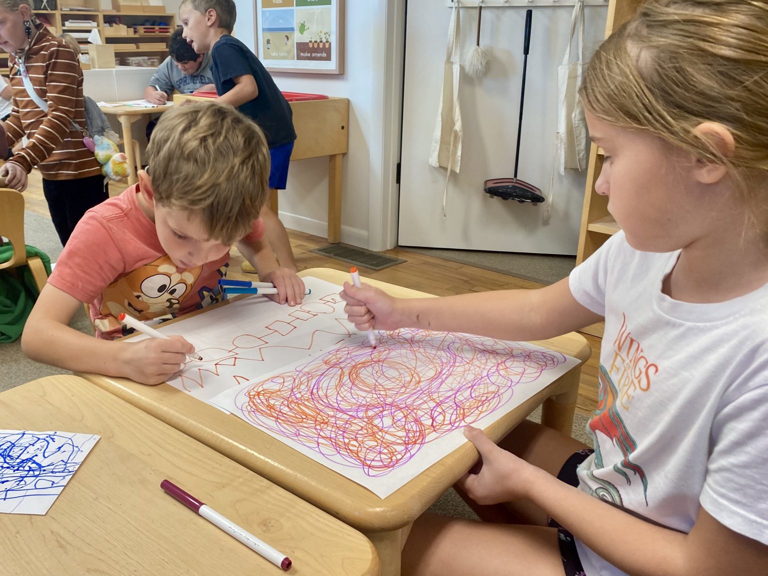 Young students creating colorful art together