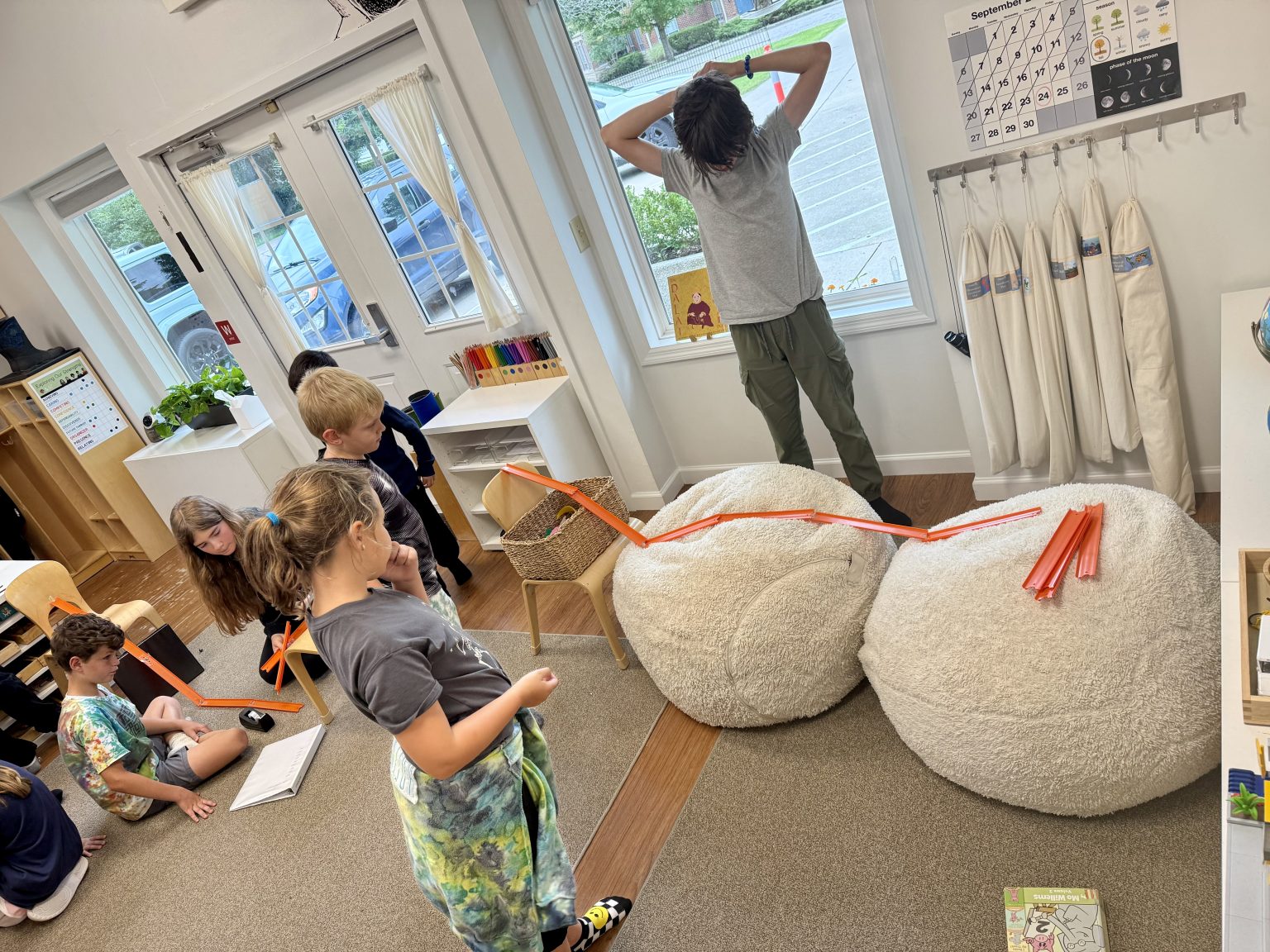 A bright Montessori classroom with students at work