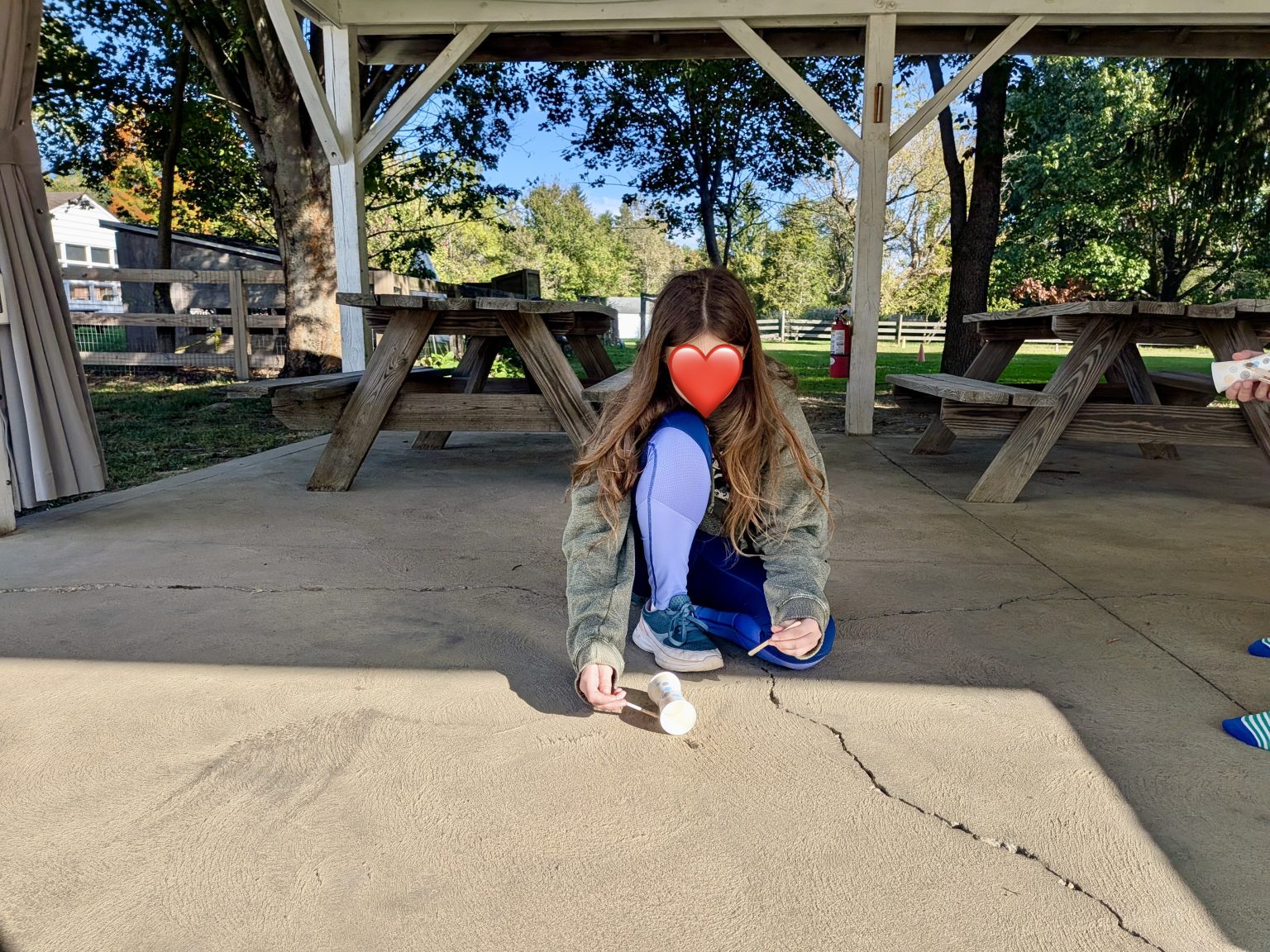 A student creating chalk art outdoors