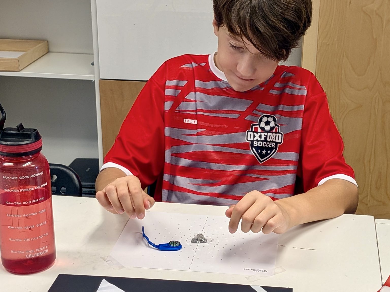 An Upper Elementary student working on a science project